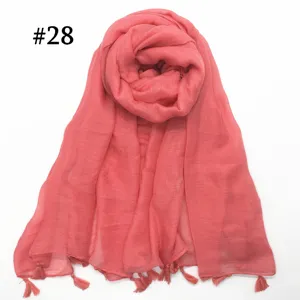 Detailed shot of coral pink sheer voile scarf with tassel fringe, lightweight and breathable.