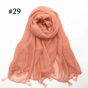 Solid color lightweight voile scarf with delicate tassel detail for women, soft and breathable.