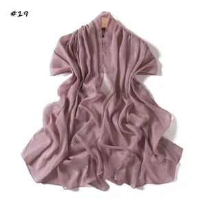 Detailed view of the shimmering chiffon scarf in mauve, lightweight and breathable fabric.