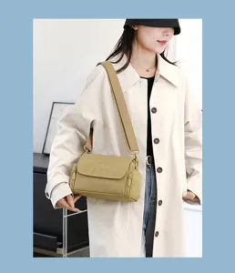 Casual minimalist crossbody bag for women with wide strap and chic flap pocket design.