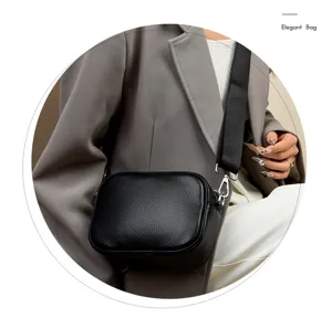 Black genuine leather crossbody camera bag with wide strap, elegant daily fashion purse.