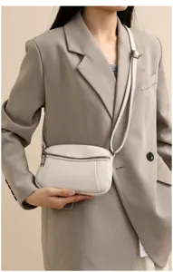Genuine leather small crossbody bag for women, minimalist mini shoulder bag with zippers.