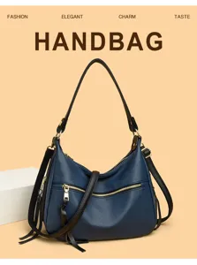 Blue leather crossbody handbag with elegant design and spacious capacity for daily commute.