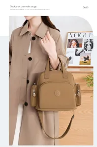 Detail view of khaki nylon handbag featuring multi-compartment design and elegant shoulder strap.