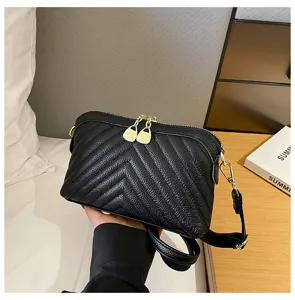 Black leather shoulder bag for women, chic chevron quilted design with metal zipper.