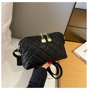 Black quilted leather crossbody bag for women, stylish shoulder handbag with gold zipper.