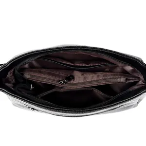 Black leather shoulder bag interior detail showing multiple zippered compartments and pockets.