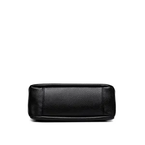 Black leather handbag bottom detail view, premium texture and durable stitching design.