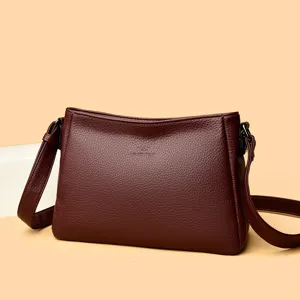 Burgundy leather shoulder crossbody bag detail, minimalist design, large capacity.