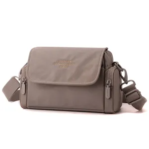 Detailed view of the stylish commuter crossbody bag featuring adjustable straps and quality zippers.