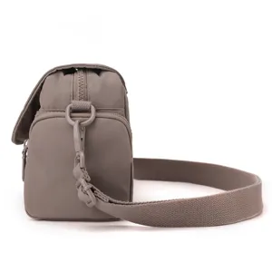 Detail view of the stylish women casual nylon crossbody bag, showing strap and zipper.