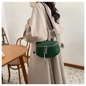 Trendy green genuine leather saddle bag for women, elegant daily crossbody bag with wide strap.