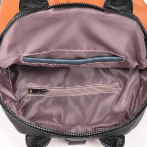 Leather backpack interior detail, premium lining with secure zip pocket and slip pocket.