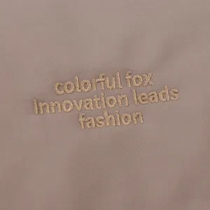 Close-up detail of stylish embroidered crossbody bag fabric texture minimalist outdoor design