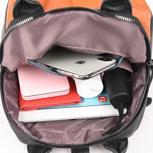 Genuine leather color-block women backpack detail view showing spacious interior capacity storage.