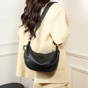 Black leather hobo shoulder bag detail, soft dumpling shape, adjustable strap for women.
