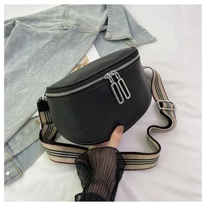 Trendy genuine cowhide leather saddle bag for women, stylish crossbody bag with striped strap.