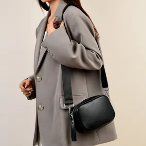 Elegant black leather crossbody bag for women, stylish shoulder handbag with wide strap.