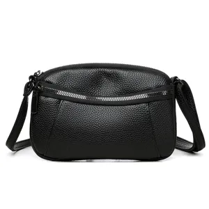 Stylish black leather crossbody bag for women, mini shoulder bag with double zippers.