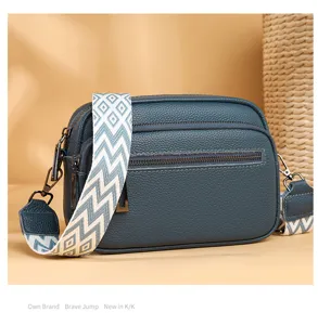Sac bandoulière homme en cuir véritable, sangle large tendance, double fermeture éclair.