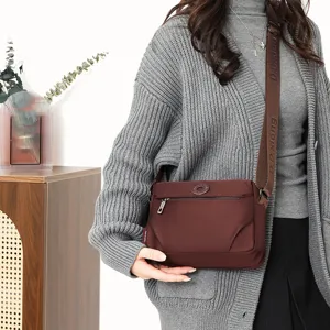 Casual women nylon crossbody bag versatile lightweight stylish shoulder bag for daily use.