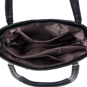 Black soft leather tote bag inner structure detail view showing multiple functional zipper pockets.