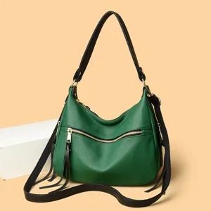 Green leather shoulder crossbody bag for women, large capacity stylish commuter handbag.
