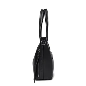 Black leather tote bag side view detail showing zipper and soft texture handle design