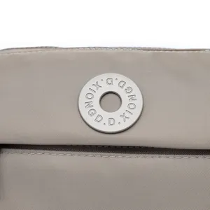 Nylon crossbody bag detail view, waterproof fabric and custom metal hardware design.