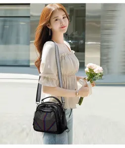 Detail view of the stylish multi-way women backpack with rivet decor and woven strap.