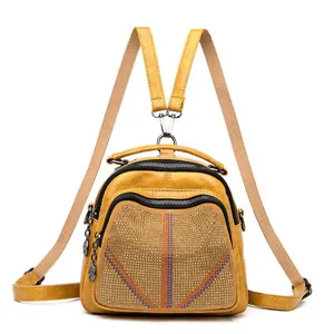 Stylish yellow women multi-functional backpack with rhinestone studs for daily wear.