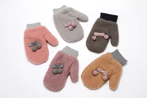 Cute winter fleece-lined mittens for women, thick warm plush gloves with sweet pom-poms.