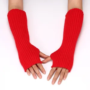 Close-up of red knitted arm warmers, showing the soft ribbed texture and fingerless design.