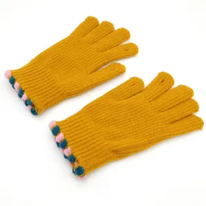 Detailed shot of winter warm knit touchscreen gloves in yellow with colorful pom-pom wrist trim.