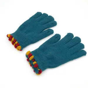 Warm knitted five-finger winter gloves featuring colorful pom-pom cuffs for daily wear.