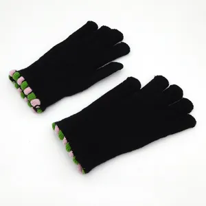 Winter warm black knitted gloves with colorful cuffs for cold weather outdoor daily wear.