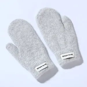Women winter thick plush warm mittens in light grey with cute tag detail, soft and cozy fabric.