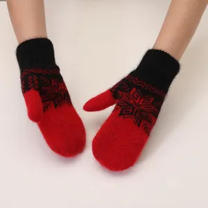 Close-up detail of winter warm knitted mittens, soft plush rabbit fur and cozy fleece lining.