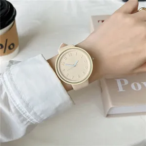 Detail view of a minimalist macaron silicone watch with embossed numbers and soft strap.