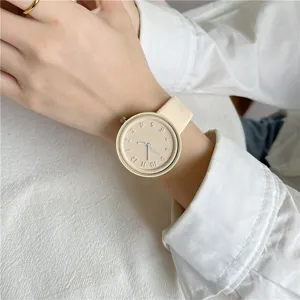 Minimalist silicone student watch detail view, soft cream color dial and comfortable strap.