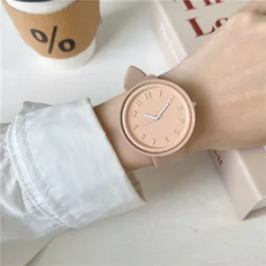 Minimalist macaron silicone watch wrist detail shot with clean aesthetic background style.