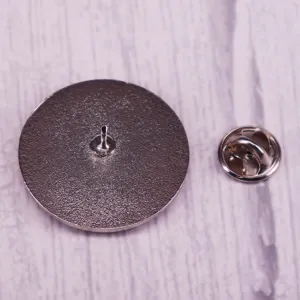 Metal brooch pin back and clutch accessory detail view showing quality construction.