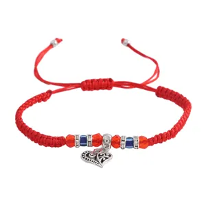 Bracelet tressé rouge avec mauvais œil et pendentif cœur, bijou de mode réglable pour femmes.