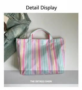 Colorful PVC striped tote bag detail, featuring waterproof material and dual top handles.
