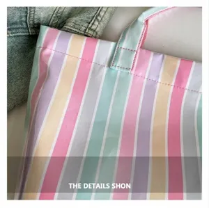 PVC striped tote bag detail showcasing colorful waterproof material and sturdy dual handles.