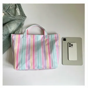 PVC striped large capacity tote bag detail view, waterproof commuter shoulder handbag.