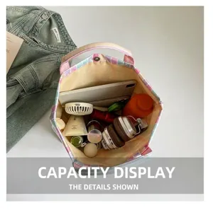 Detail view of the large capacity striped PVC tote bag showing internal storage space neatly.