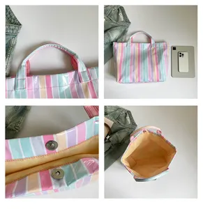PVC striped tote bag for women, large capacity waterproof handbag, stylish commuter shoulder bag.