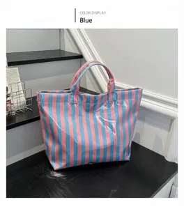 PVC striped tote bag detail, blue and pink design, waterproof casual shoulder bag.