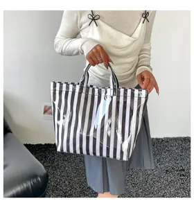 PVC striped large capacity tote bag for women, waterproof commuter single shoulder bag.
